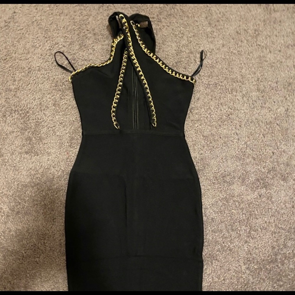 Black bodycon dress with gold cross chains